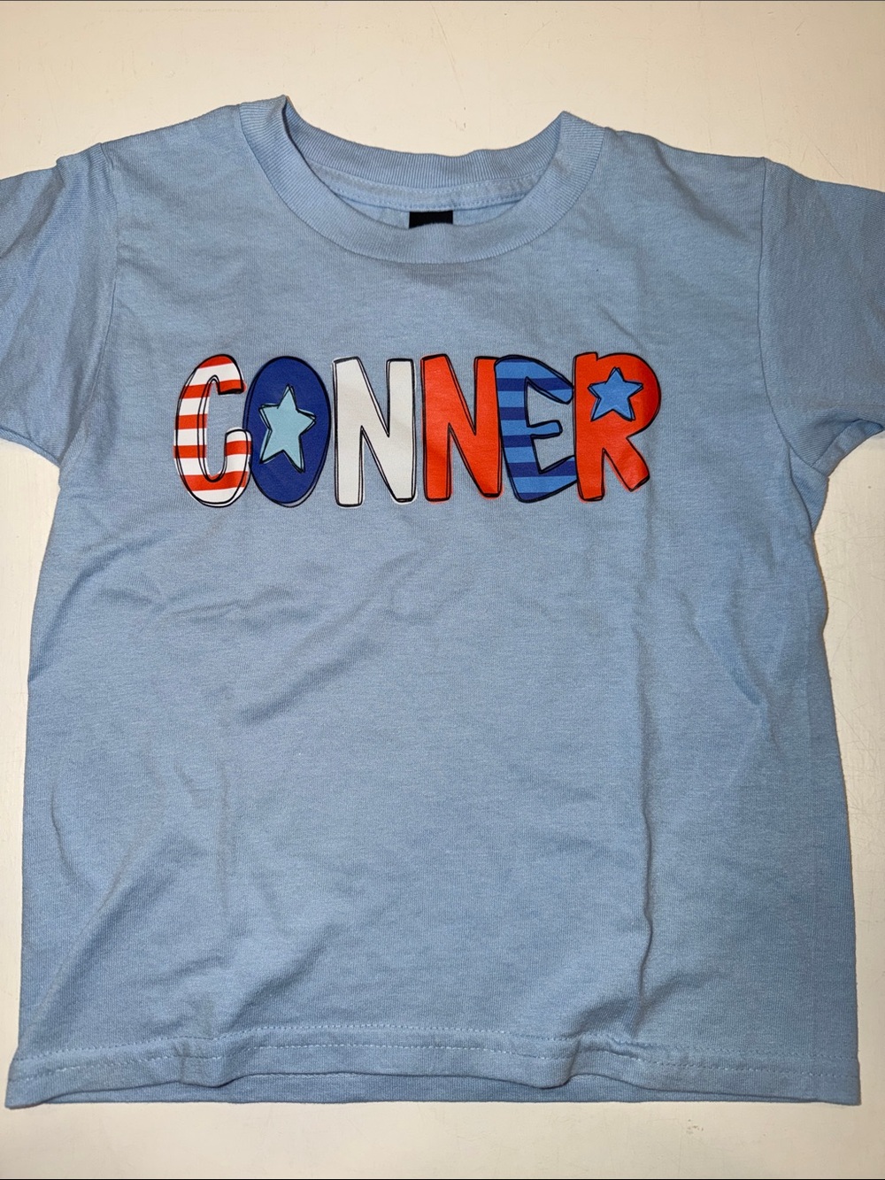 Gildan Light Blue CONNER Graphic Tee with Red & Navy Accents